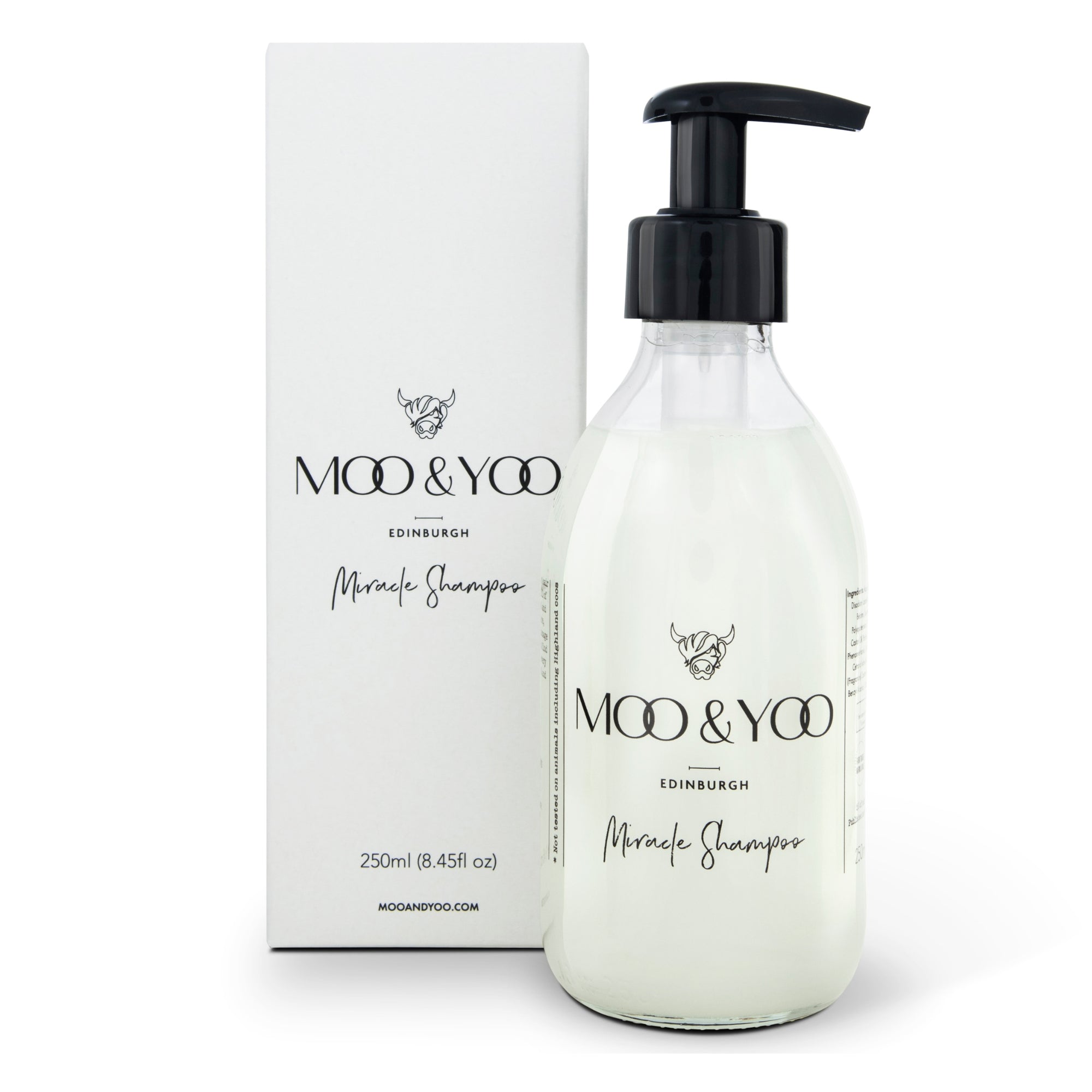 A bottle of Miracle Shampoo by MOO & YOO with a pump dispenser, placed next to its packaging box.
