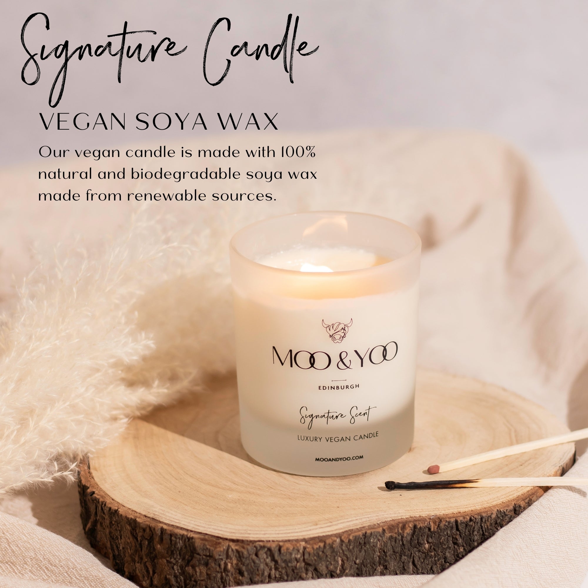 Vegan soy wax candle on a wooden coaster with ingredient profile