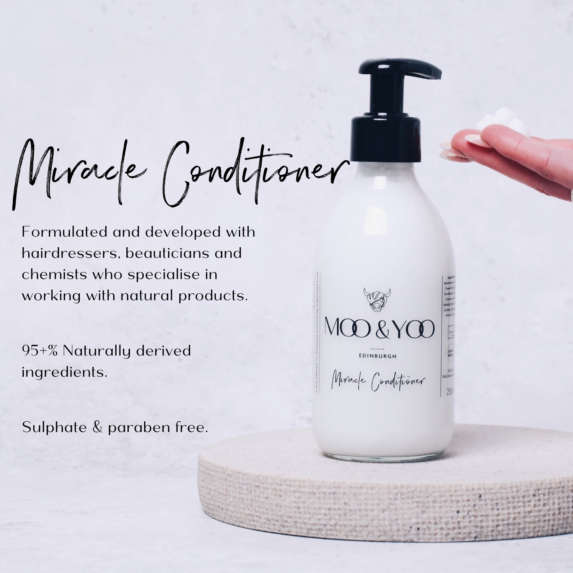 Moo & Yoo Miracle Conditioner bottle with text about product on a white background.