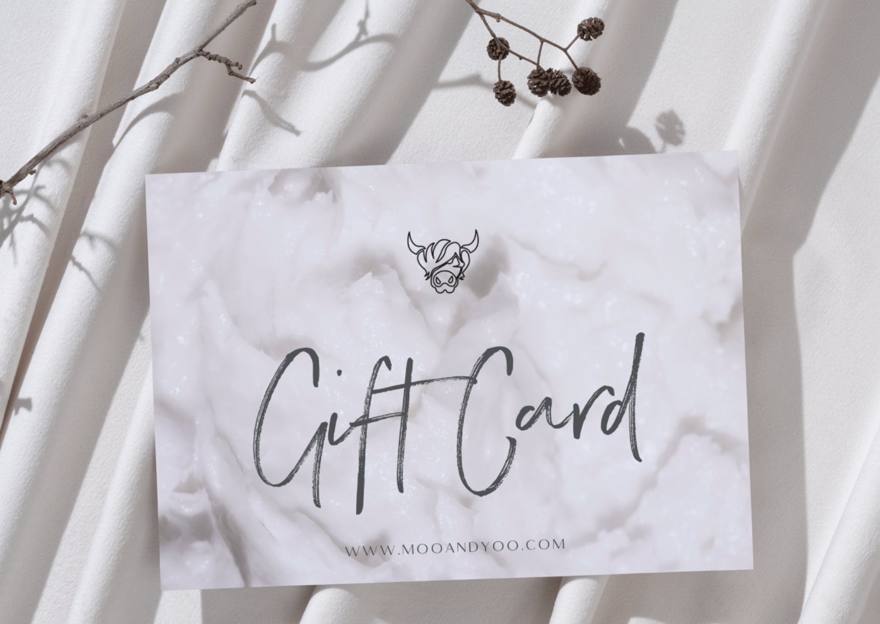 Gift card with creamy hair mask texture background and brand logo on a white background sheet with some branches