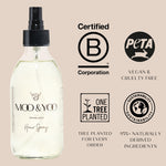Moo & You hair spray bottle with certification logos on a beige background