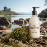 Moo & Yoo bottle of miracle milk on a natural background with a castle in the distance
