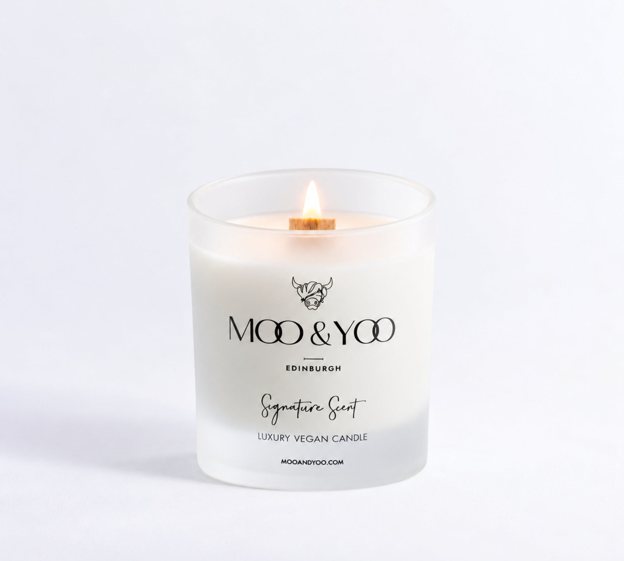 a Moo & Yoo signature scent luxury vegan candle on a white background