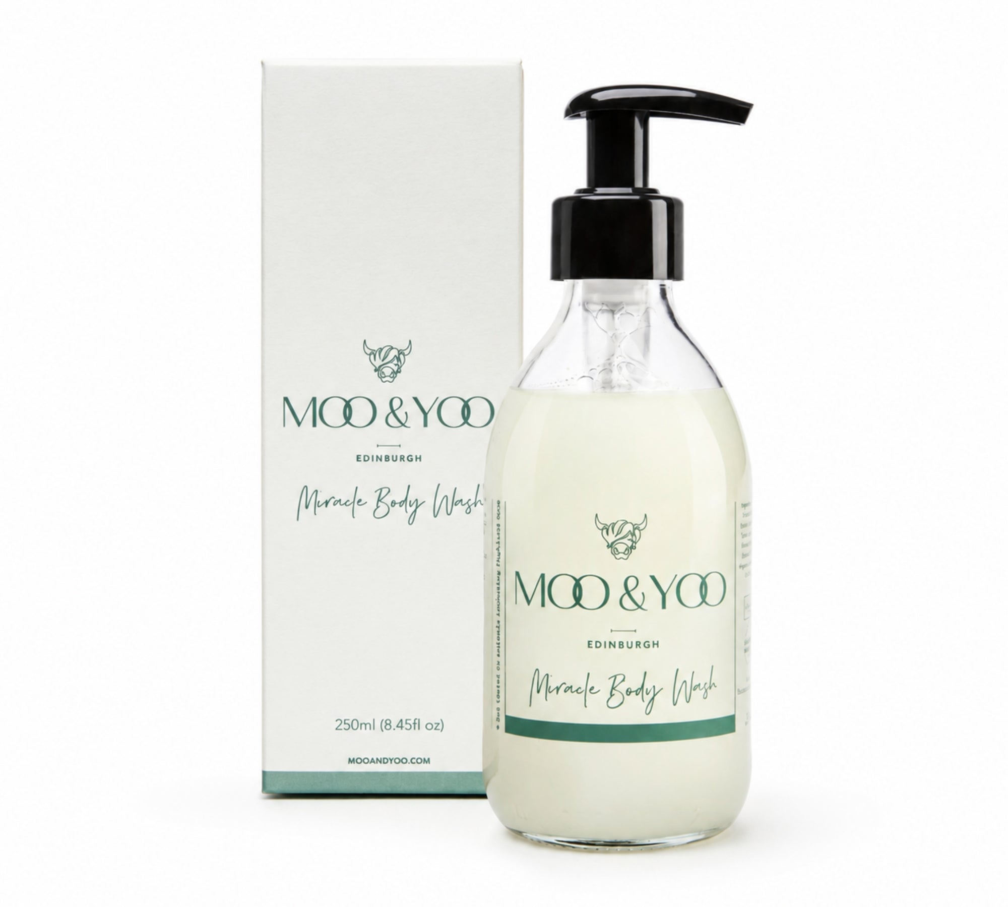 Moo & Yoo Edinburgh Miracle Body Wash in a clear bottle with a black pump dispenser, shown next to its white packaging box on a white background.