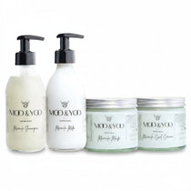 A set of four hair care products from MOO & YOO, including a shampoo, milk, mask, and curl cream, each in a 250ml container, displayed against a white background.