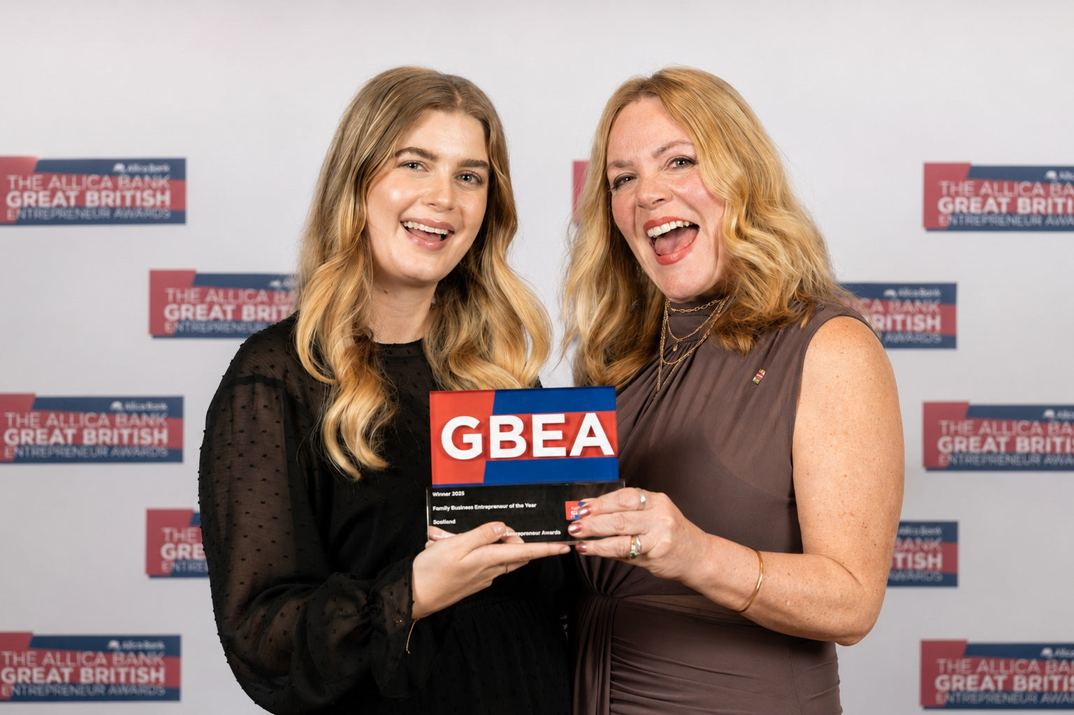 Moo & Yoo founders celebrating with their Family Business Entrepreneurs of the Year Scotland award at the Great British Entrepreneur Awards.