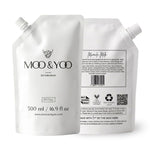 Moo & Yoo refill pouch showing the front with branding and a second pouch showing the back on the right with product details against a white background