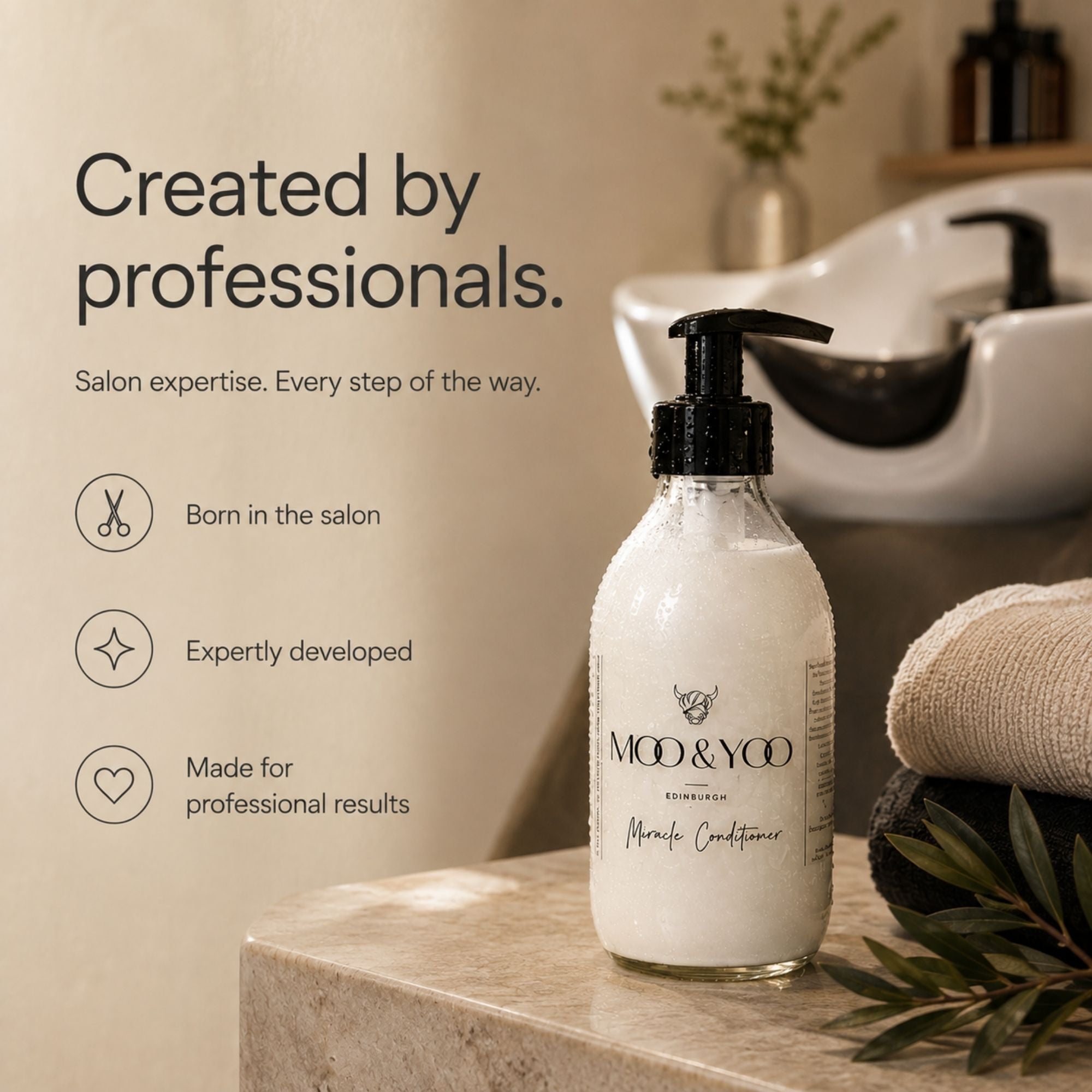 A bottle of MOD & YOO Professional Hair Conditioner with a black pump dispenser, set on a marble counter in a warm, professional salon environment with a shampoo sink and towels in the background.