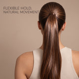 Back view of a woman with long, straight, light brown hair styled in a high ponytail, wearing a ribbed cream tank top against a solid beige background. Text in the upper left reads 'FLEXIBLE HOLD.