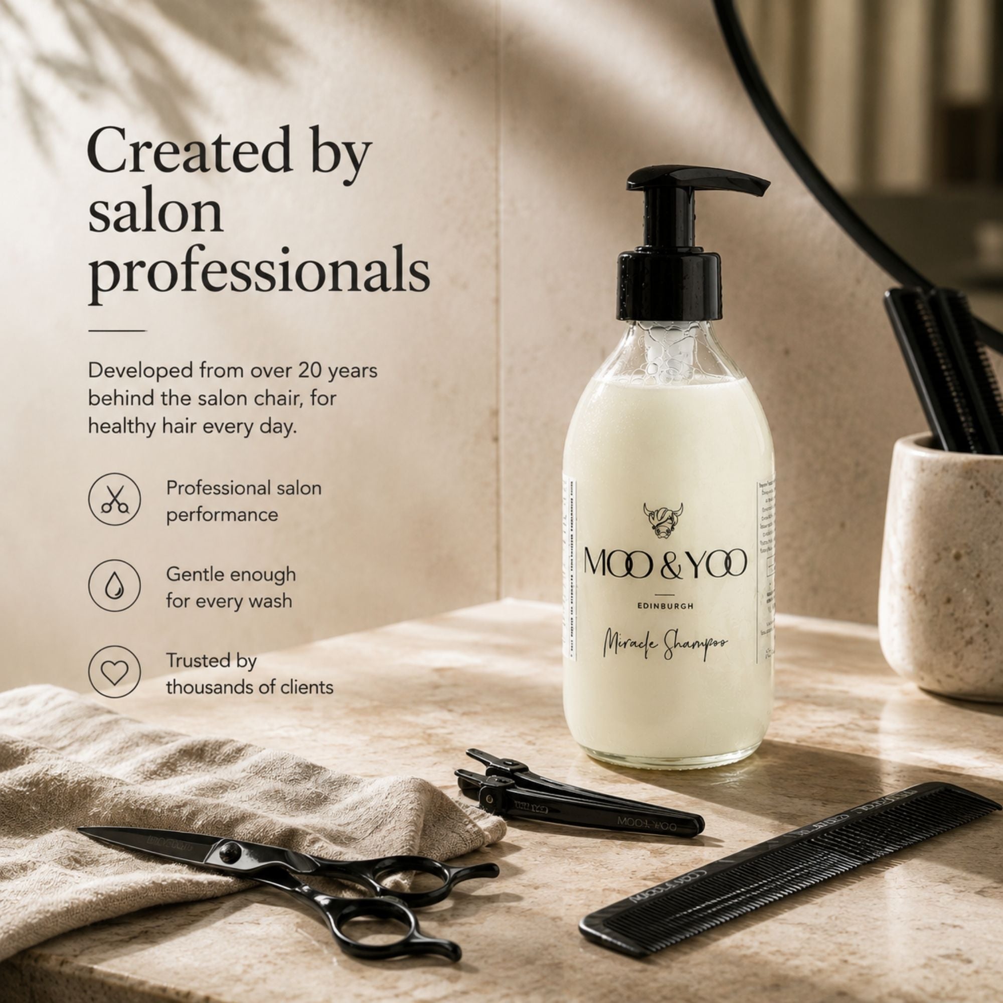 MOO & YOO Miracle Shampoo in a clear pump bottle, styled on a beige stone surface with salon tools like scissors, a comb, and a towel, alongside promotional text.
