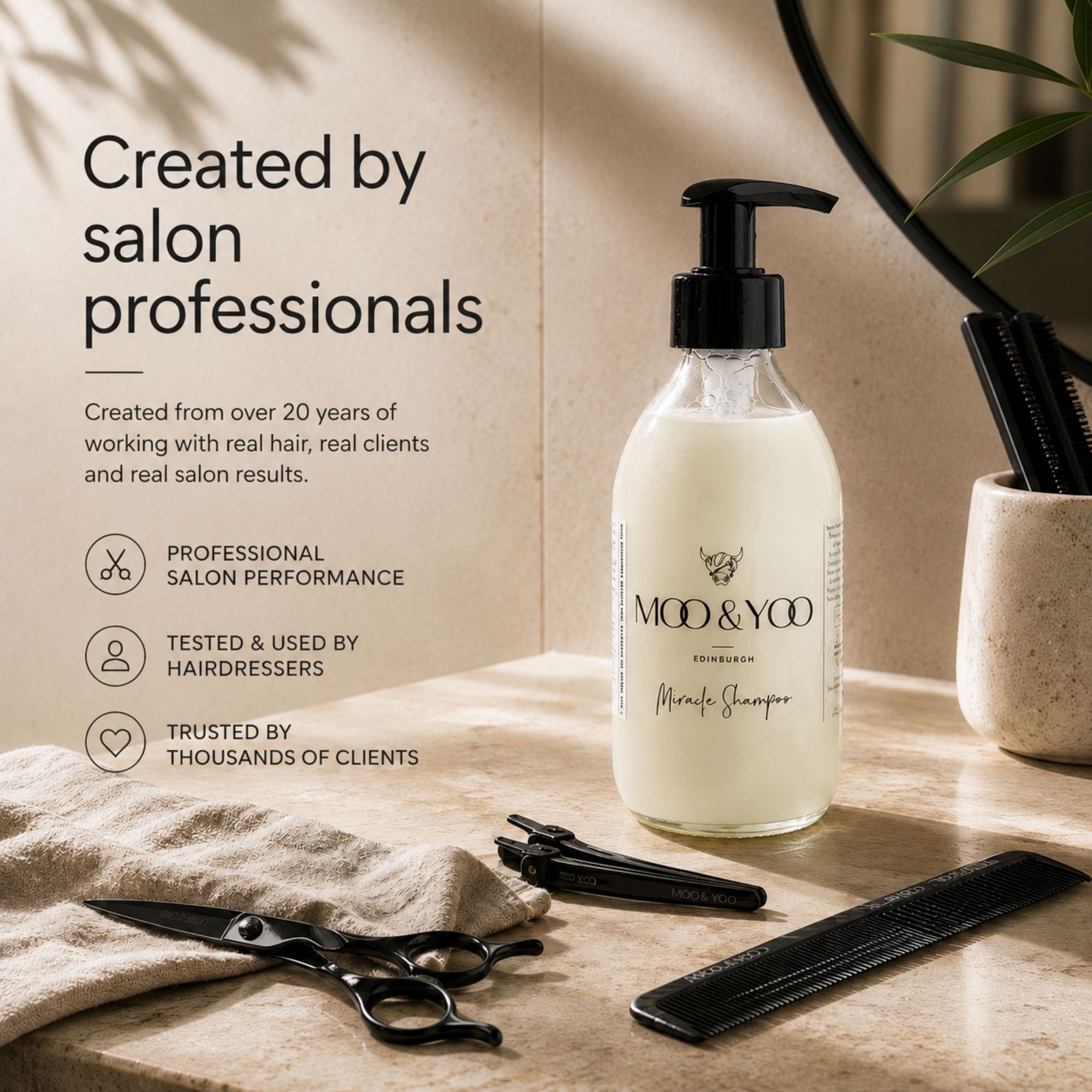 MOO & YCO Edinburgh Shampoo in a clear glass bottle with a black pump dispenser, styled on a beige stone surface with salon tools like scissors, a comb, and a hairpin, alongside promotional text on the left. Created by salon professionals.