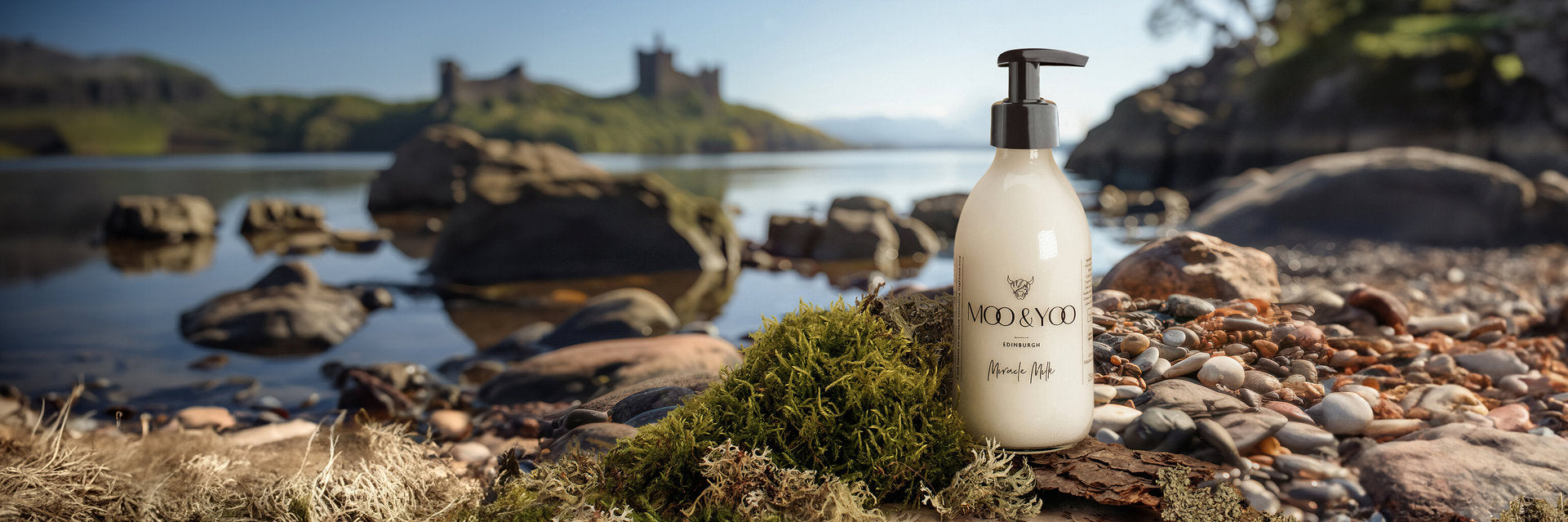 bottle of miracle milk leave in conditioner with pump on a rocky shoreline with a castle in the background