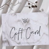 Gift card with creamy hair mask texture background and brand logo on a white background sheet with some branches 