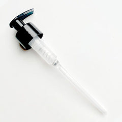 black pump dispenser on a white background