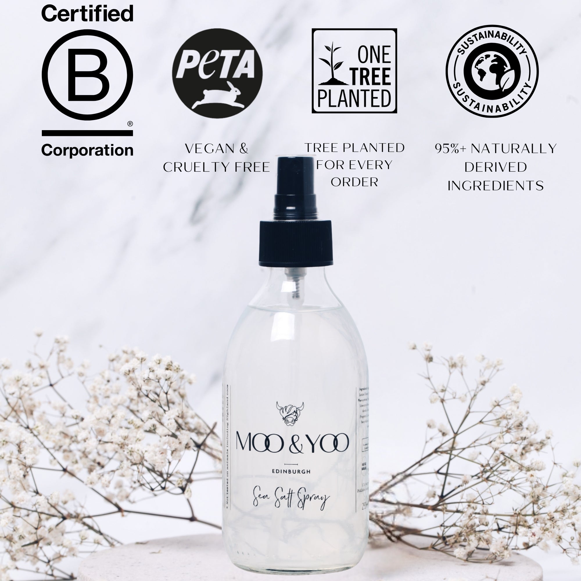 Moo & Yoo salt spray bottle with certification logos on a light background