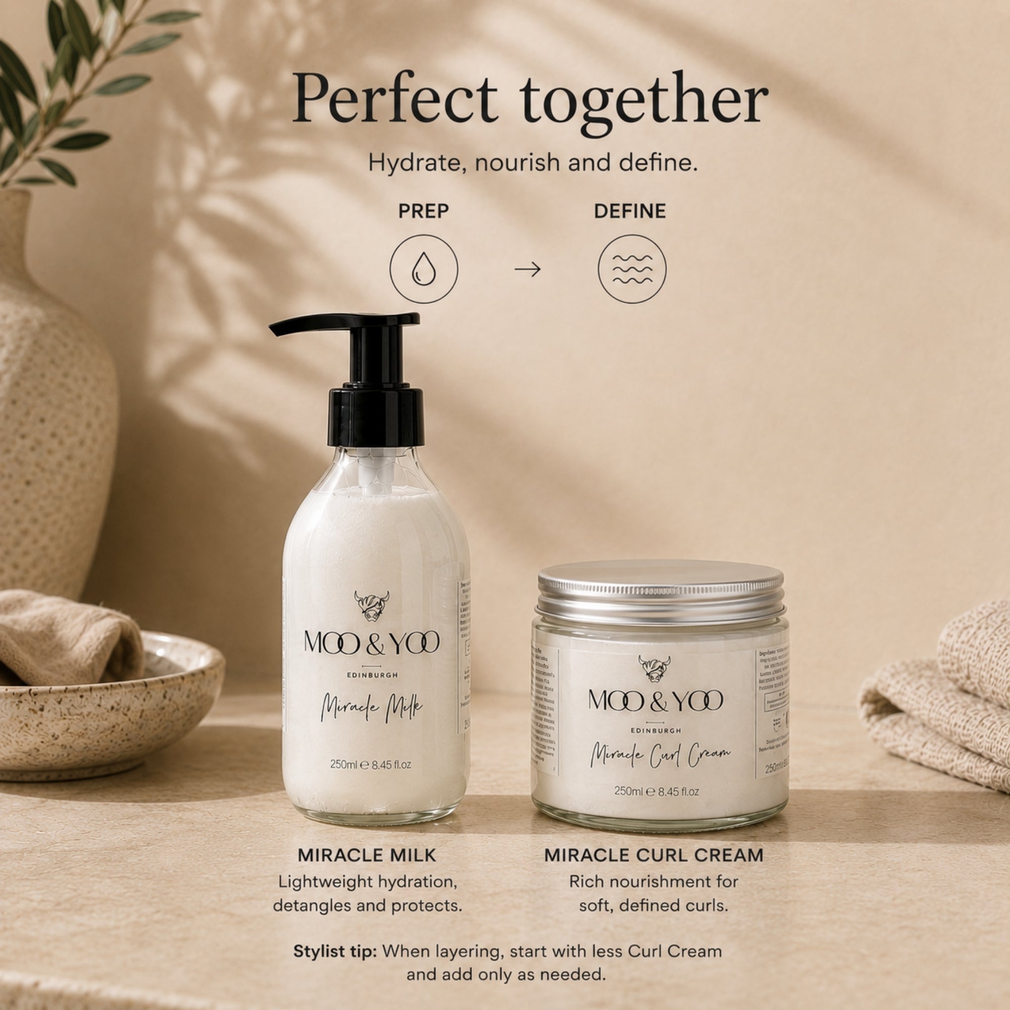 A styled product shot showing two hair-care items from MOo & Yoo: a white Miracle Milk pump bottle and a white Miracle Curl Cream jar with a silver lid, placed on a beige surface with decorative props and text overlays explaining the set.