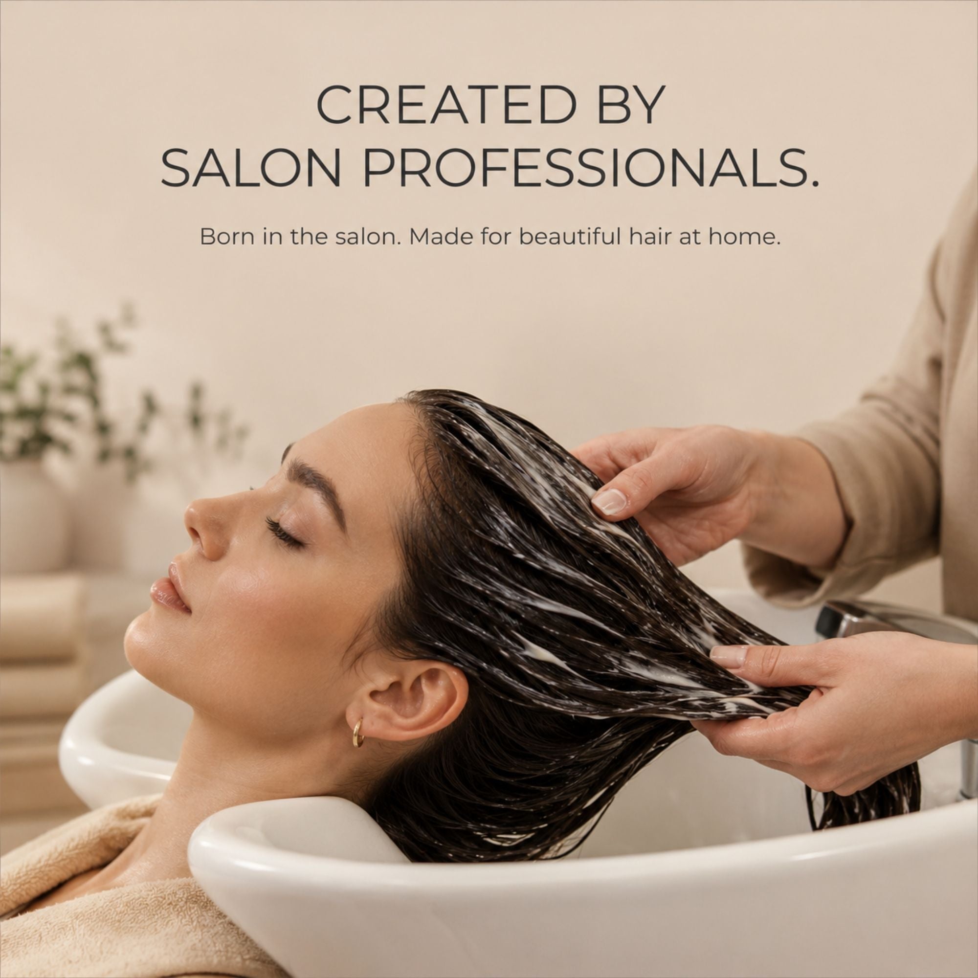 A woman with dark hair lathered in moo & yoo miracle maskrests in a salon-style sink while another person washes her hair. Text at the top reads, 'CREATED BY SALON PROFESSIONALS.