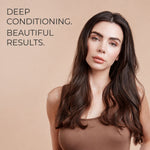 A woman with long, dark brown wavy hair wearing a brown top, posed against a solid beige background with the text 'DEEP CONDITIONING. BEAUTIFUL RESULTS.