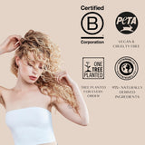 Woman with blonde curly voluminous hair against a beige background with certification logos.