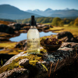 Bottle of Moo & Yoo volumising spray mist on a rock with a scenic background of Scottish munros and wetland